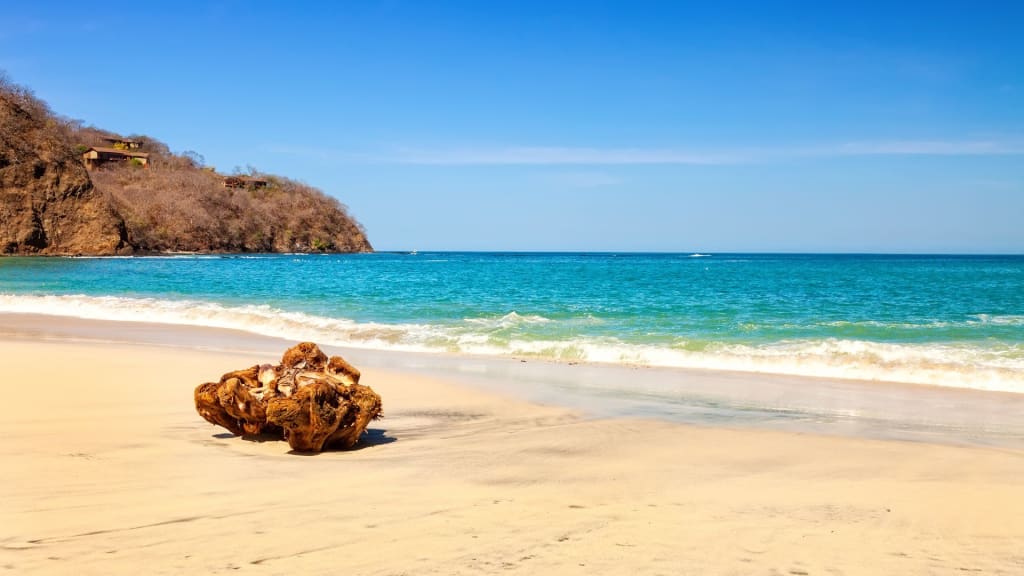Beach with clear sky and warm sun in Costa Rica